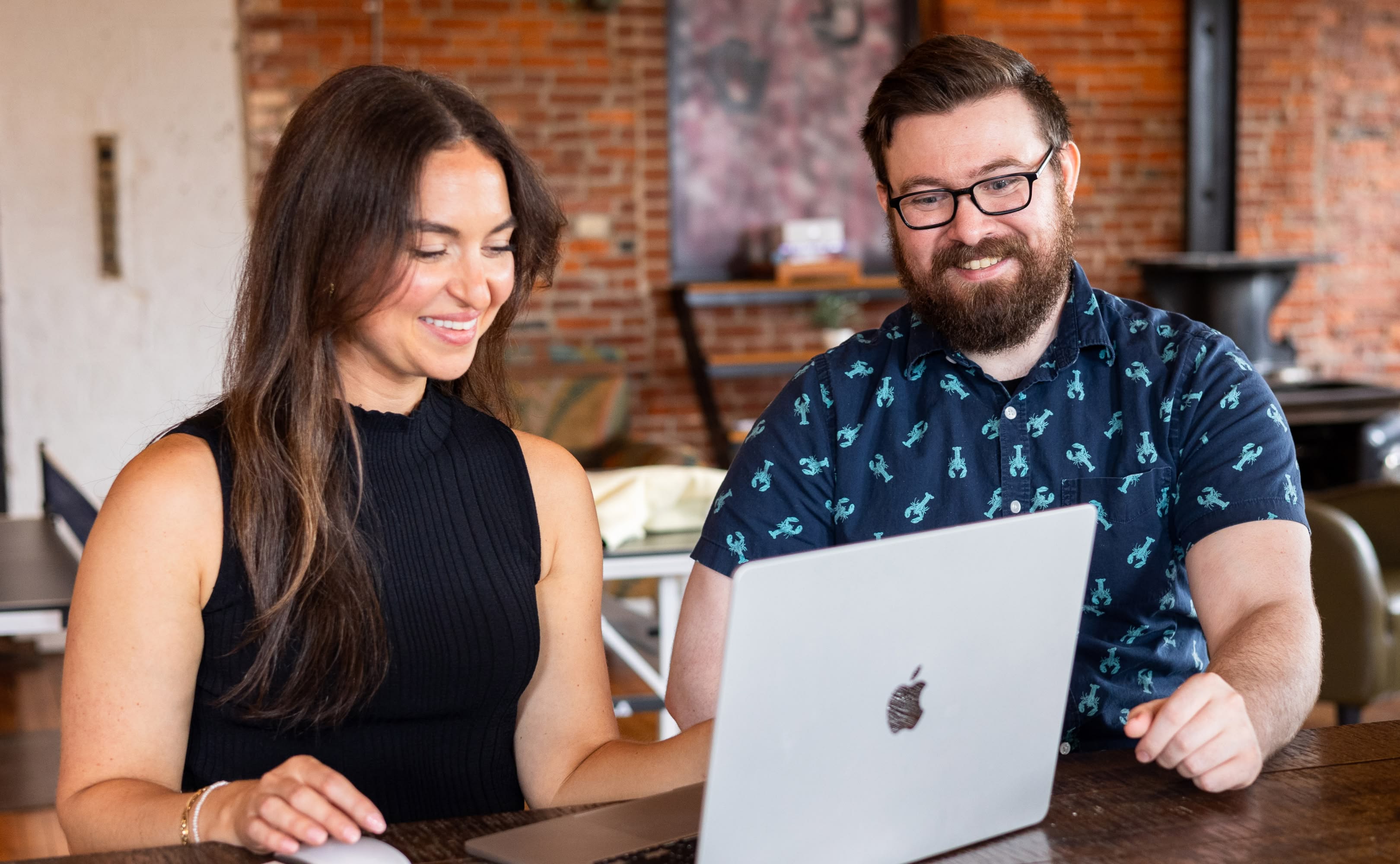 Push10 2024 Photoshoot developer and senior designer looking over computer.