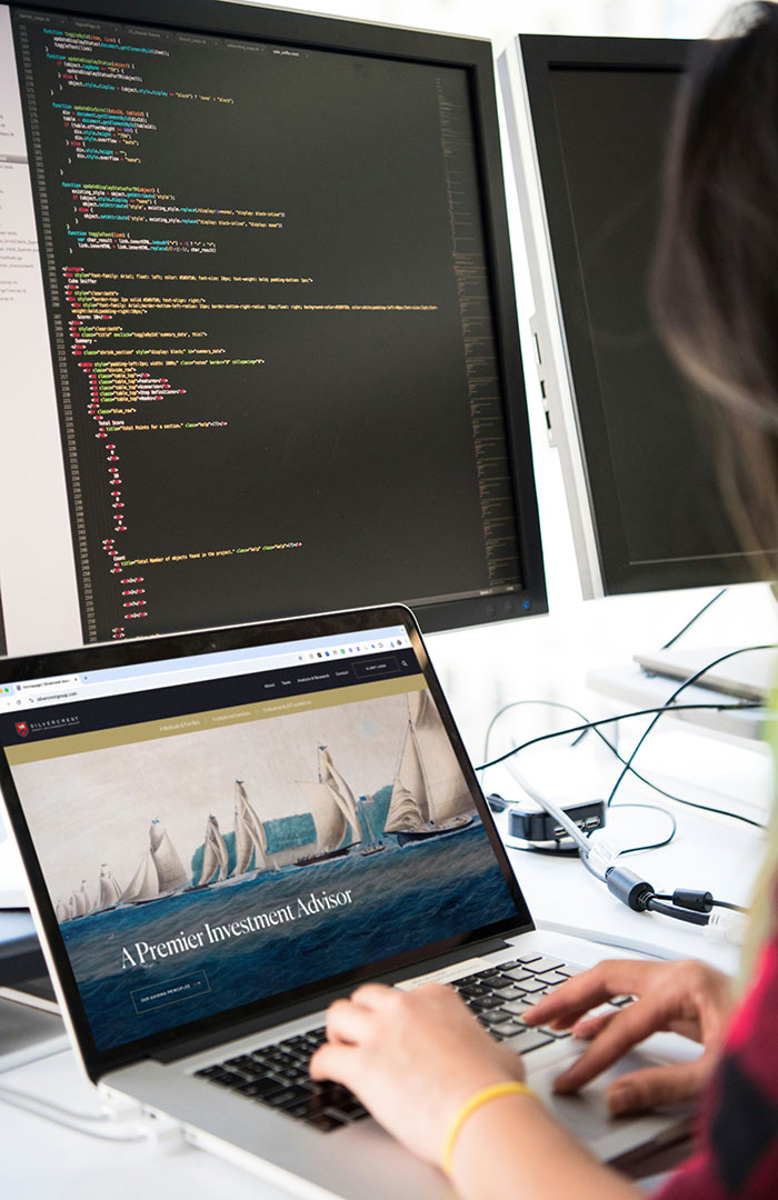 finance web developer working on laptop
