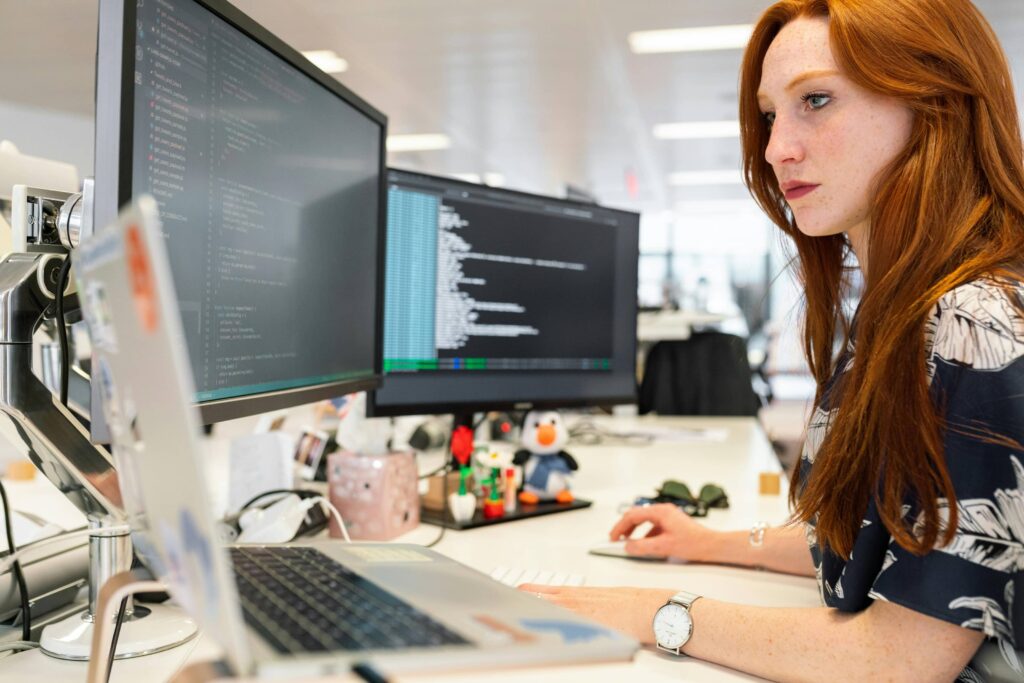 Website Developer providing reviewing code on desktop