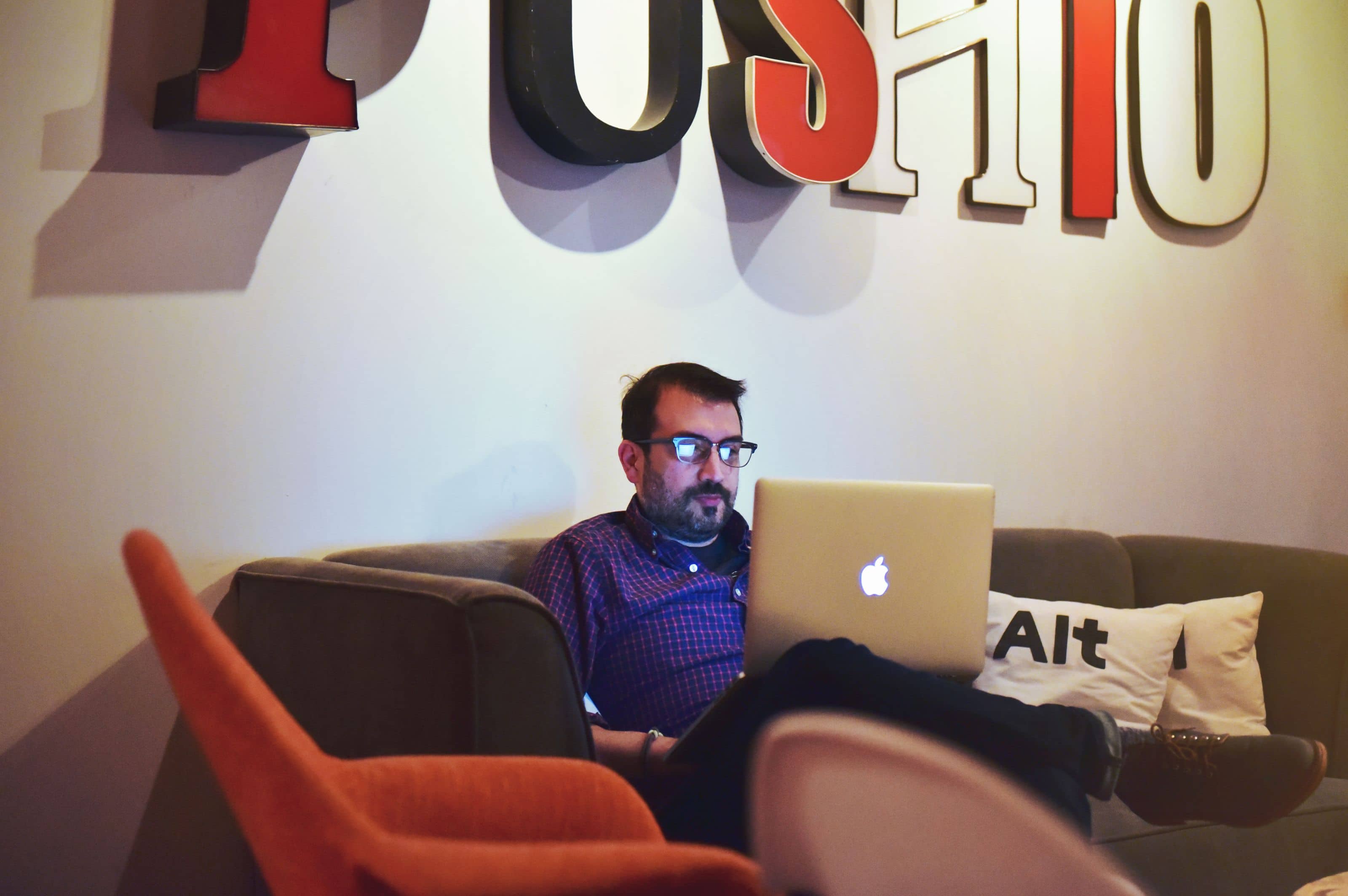 Push10 Director of Business Strategy, Ken Beasley working on laptop in office