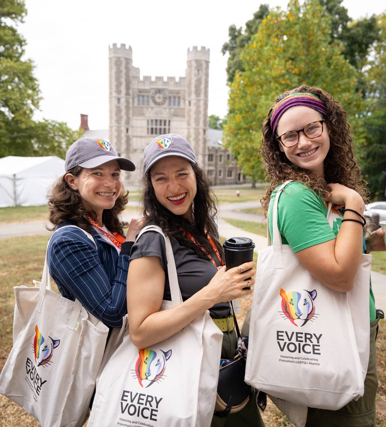 PUA Every Voice client image of three women attendees posing with their every voice tote bag