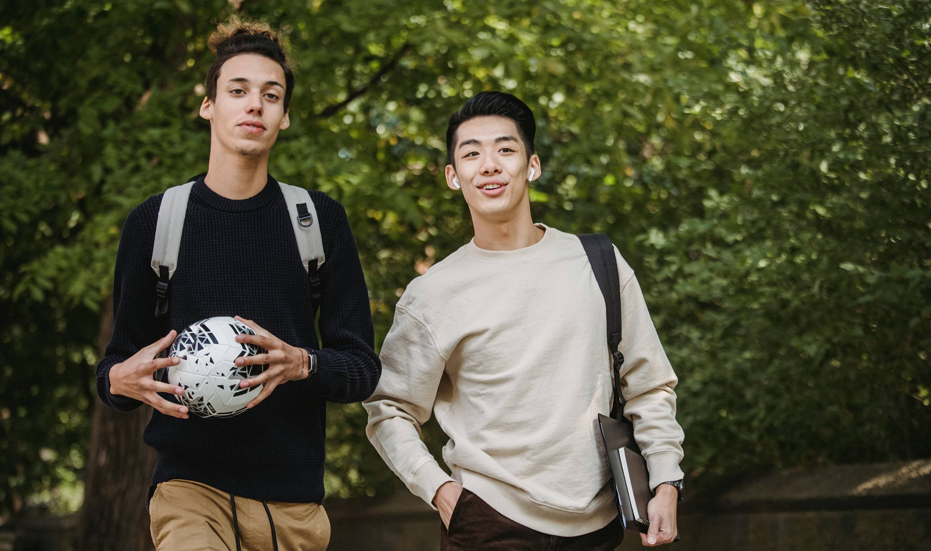 Two student athletes walking
