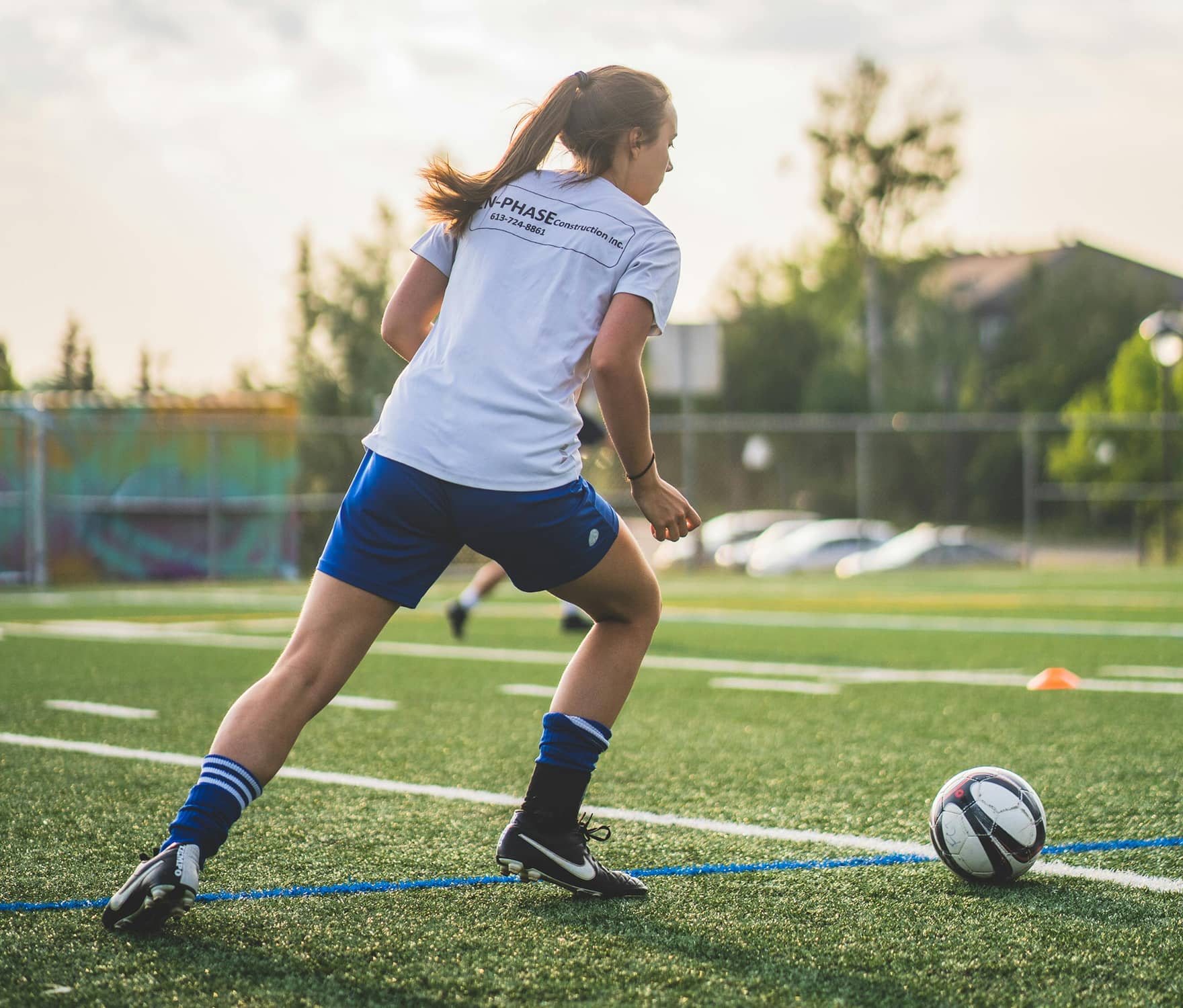 Action shot of woman playing soccer