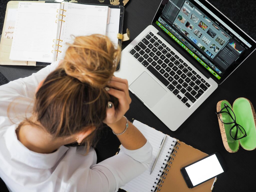 frustrated designer working on laptop