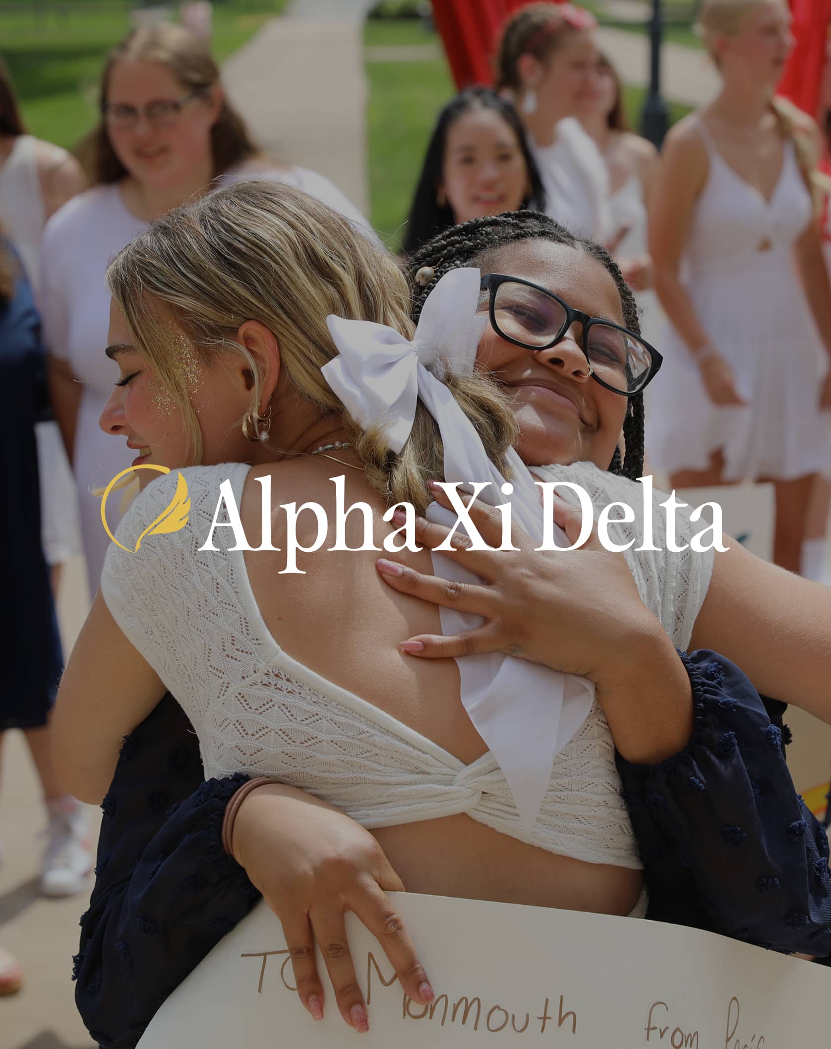 Alpha Xi Delta Sisters Hugging Over Logo