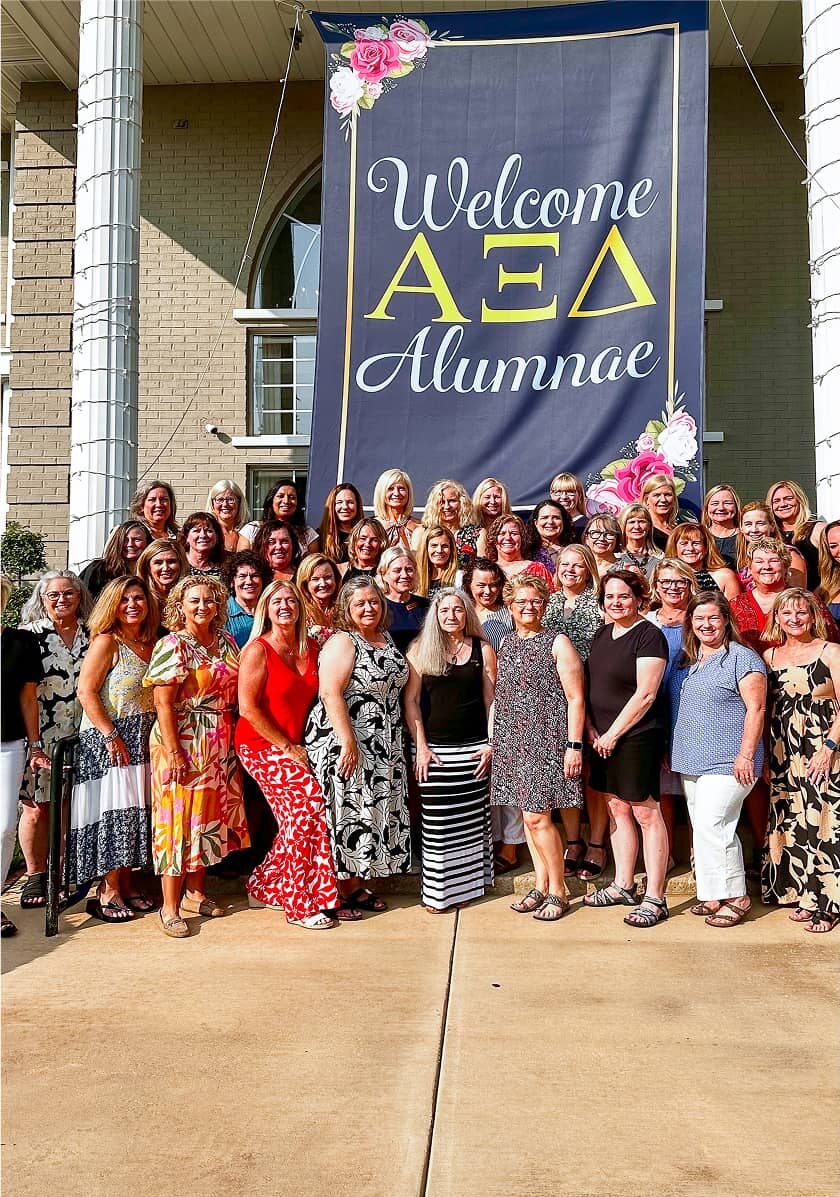 Alpha Xi Delta Alumnae Together in front of Chapter House