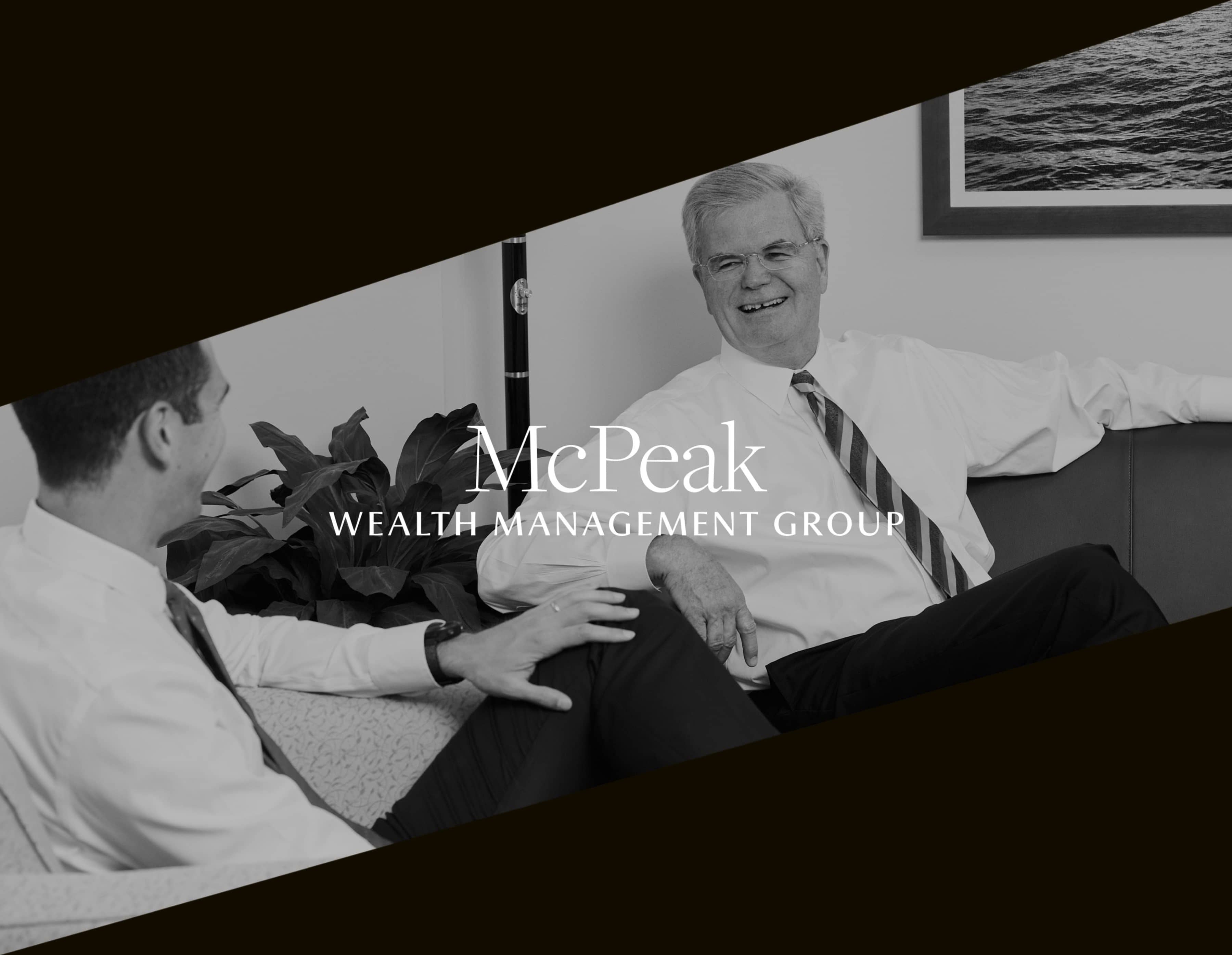 Black and White candid image of two men talking and laughing masked in a diagonal square frame