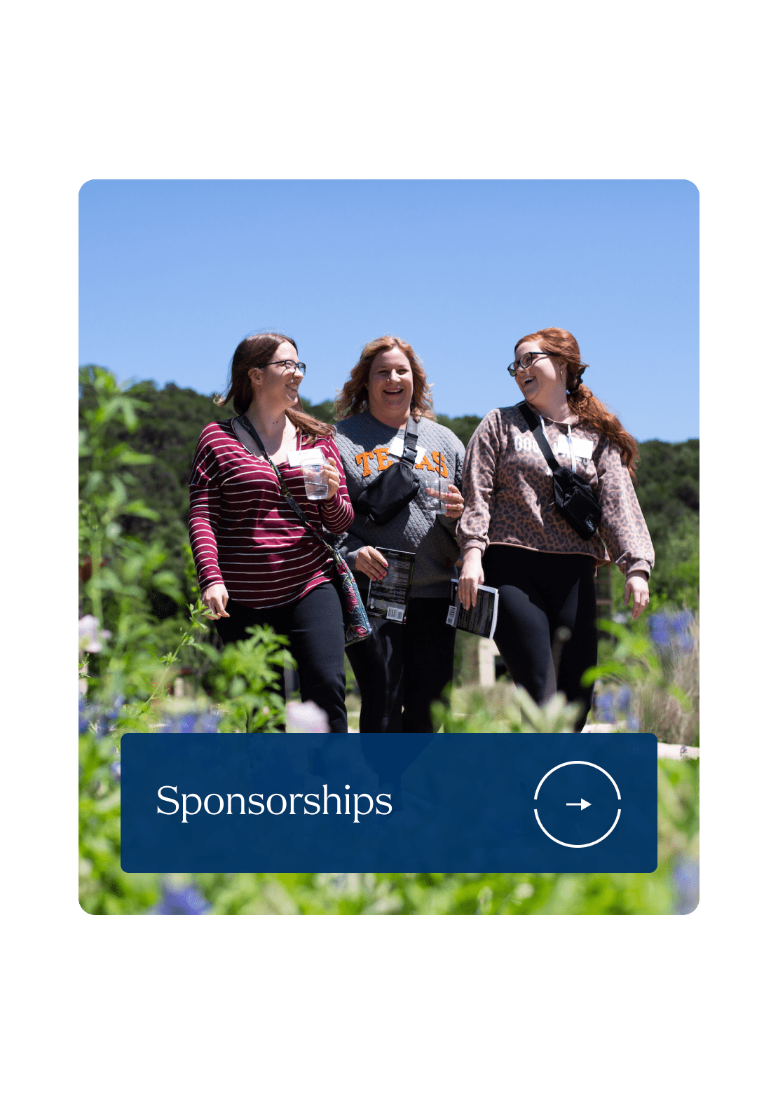 Three women walk joyfully through a garden on a sunny day, surrounded by greenery and flowers. A banner at the bottom reads 