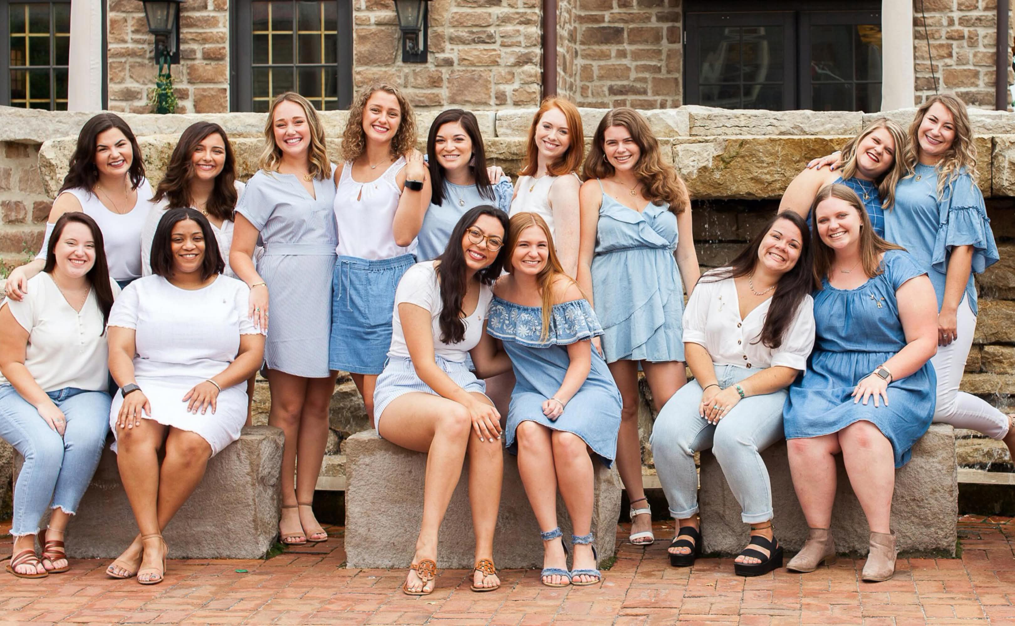 Group of Sorority members sitting and standing posing for a photo
