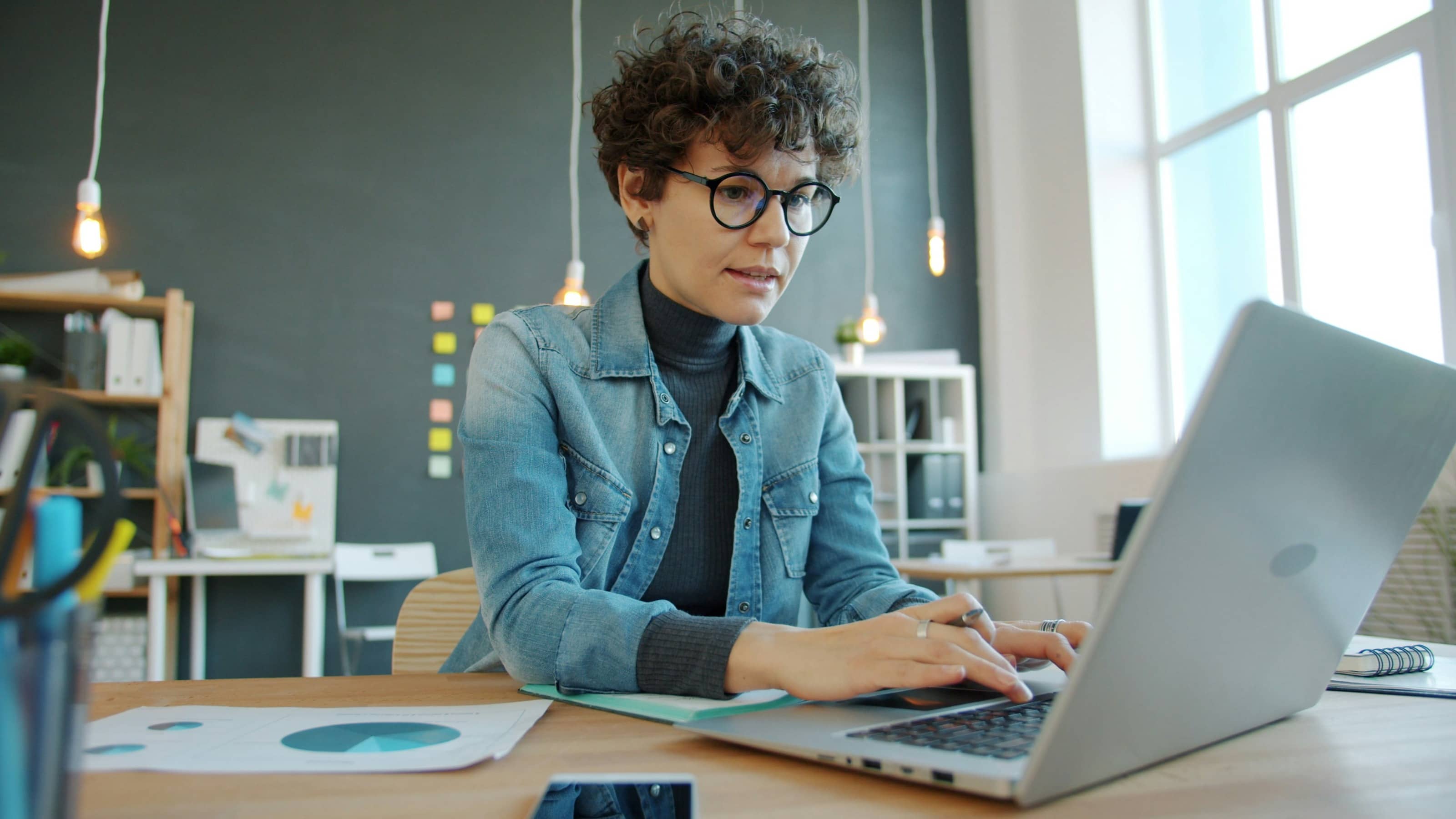 Women working for mission-driven organization typing on laptop