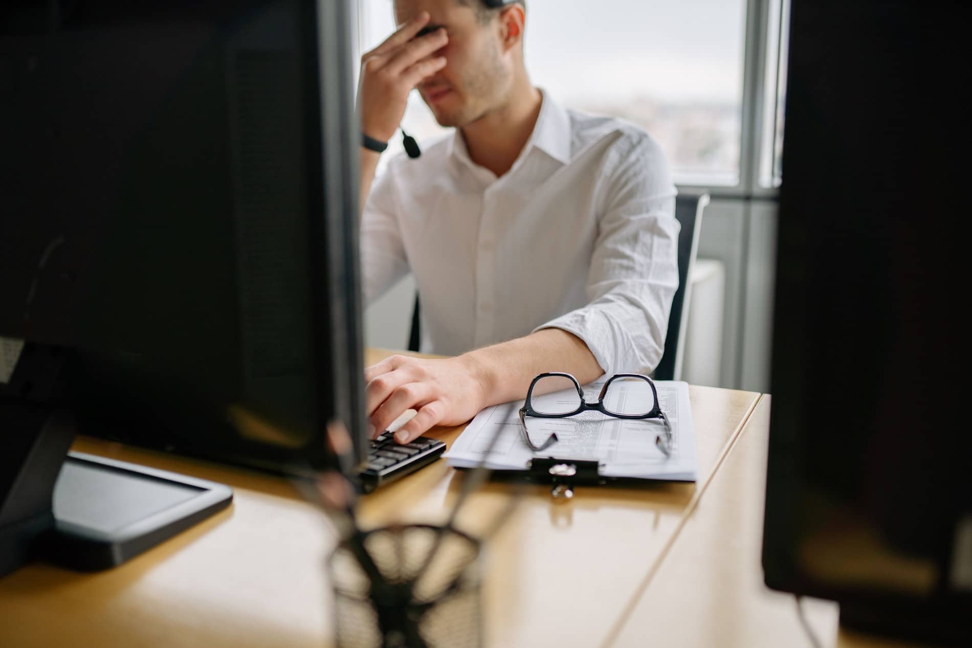 Frustrated investment advisor looking at his outdated website