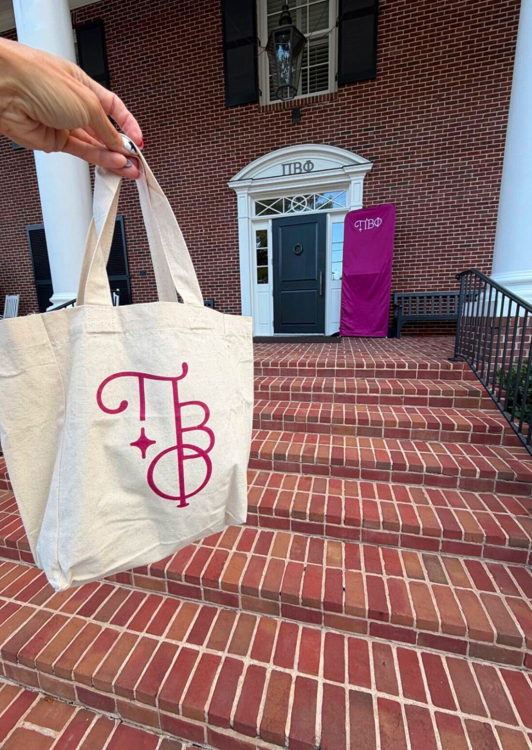 Branded sorority tote bag featuring the organization’s logo and visual identity.