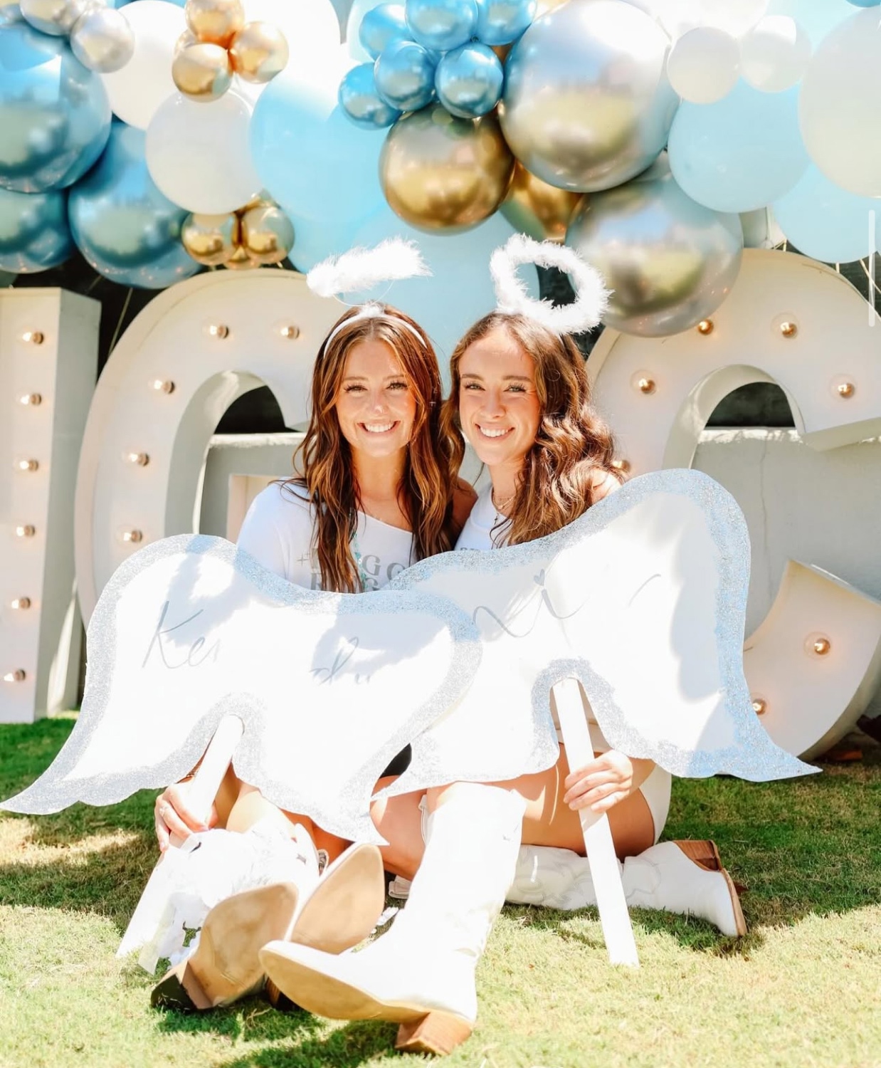 Sorority members posing for an event in matching angel costumes.